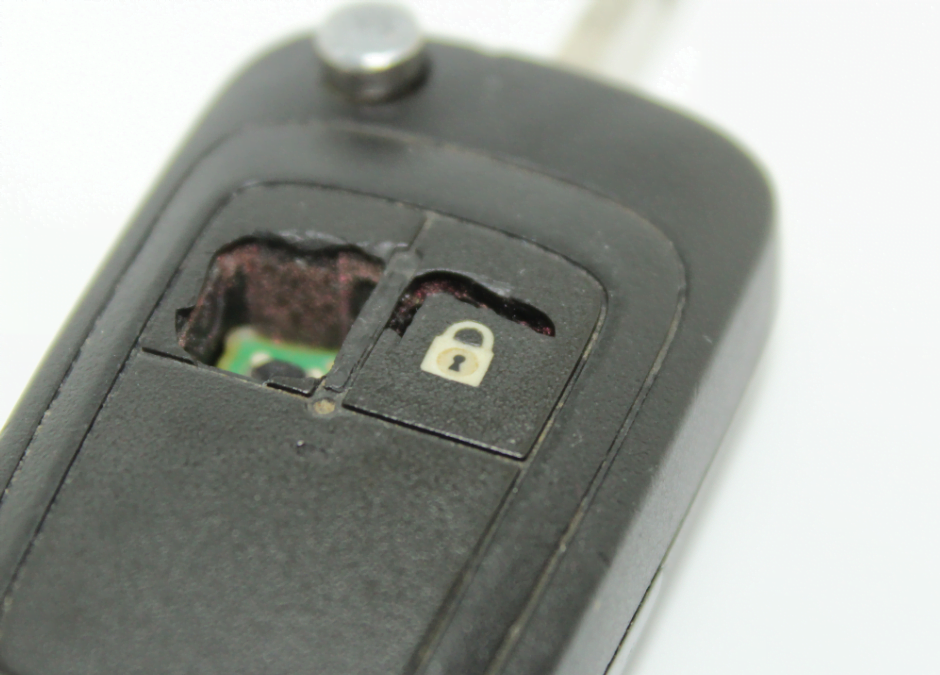 Image showing a faulty car key fob indicating the need for repair or replacement by a professional automotive locksmith.